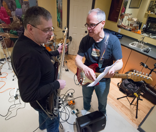 Scott Darlington and Rick Martin look over some song notes at the Shades of Grey band practice in Kanata, Ontario, February 16, 2017. Photo by Garth Gullekson