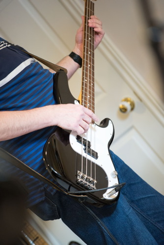 Closeup of Scott playing bass at the Shades of Grey band practice in Barrhaven, Ontario, April 5, 2017. Photo by Garth Gullekson