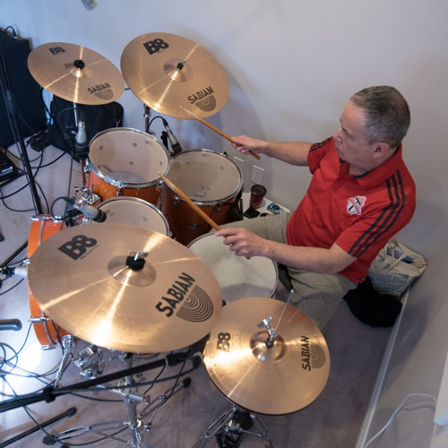 High view of Ted playing drums at the Shades of Grey band practice in Barrhaven, Ontario, April 5, 2017. Photo by Garth Gullekson