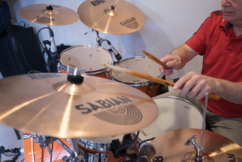 Ted playing drums at the Shades of Grey band practice in Barrhaven, Ontario, April 5, 2017. Photo by Garth Gullekson