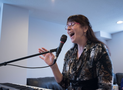 Kelly singing Heat Wave at the Shades of Grey band practice in Barrhaven, Ontario, April 5, 2017. Photo by Garth Gullekson